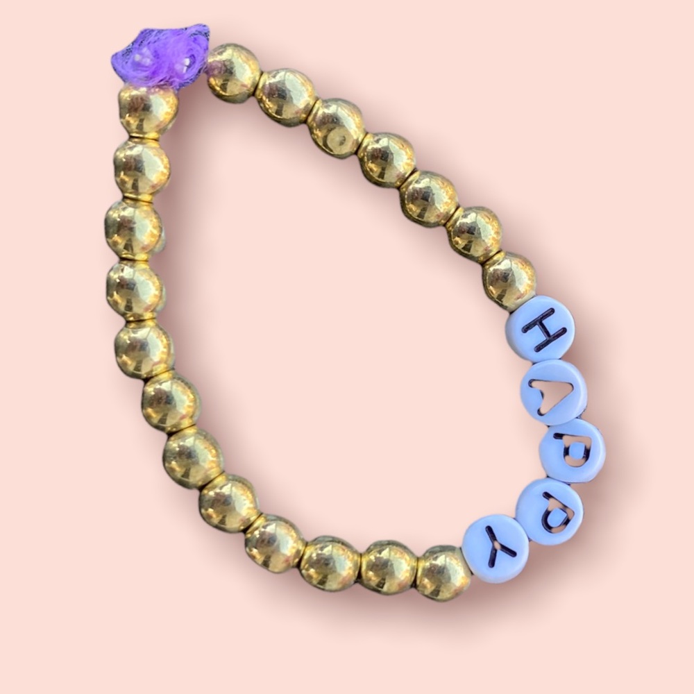 Golf bracelet happy on it